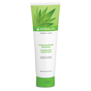 Introducing the Herbalife Herbal Aloe Strengthening Shampoo 250 ml, a nourishing haircare solution infused with the power of natural ingredients.